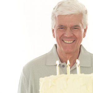 Middle-aged Man with Birthday Cake